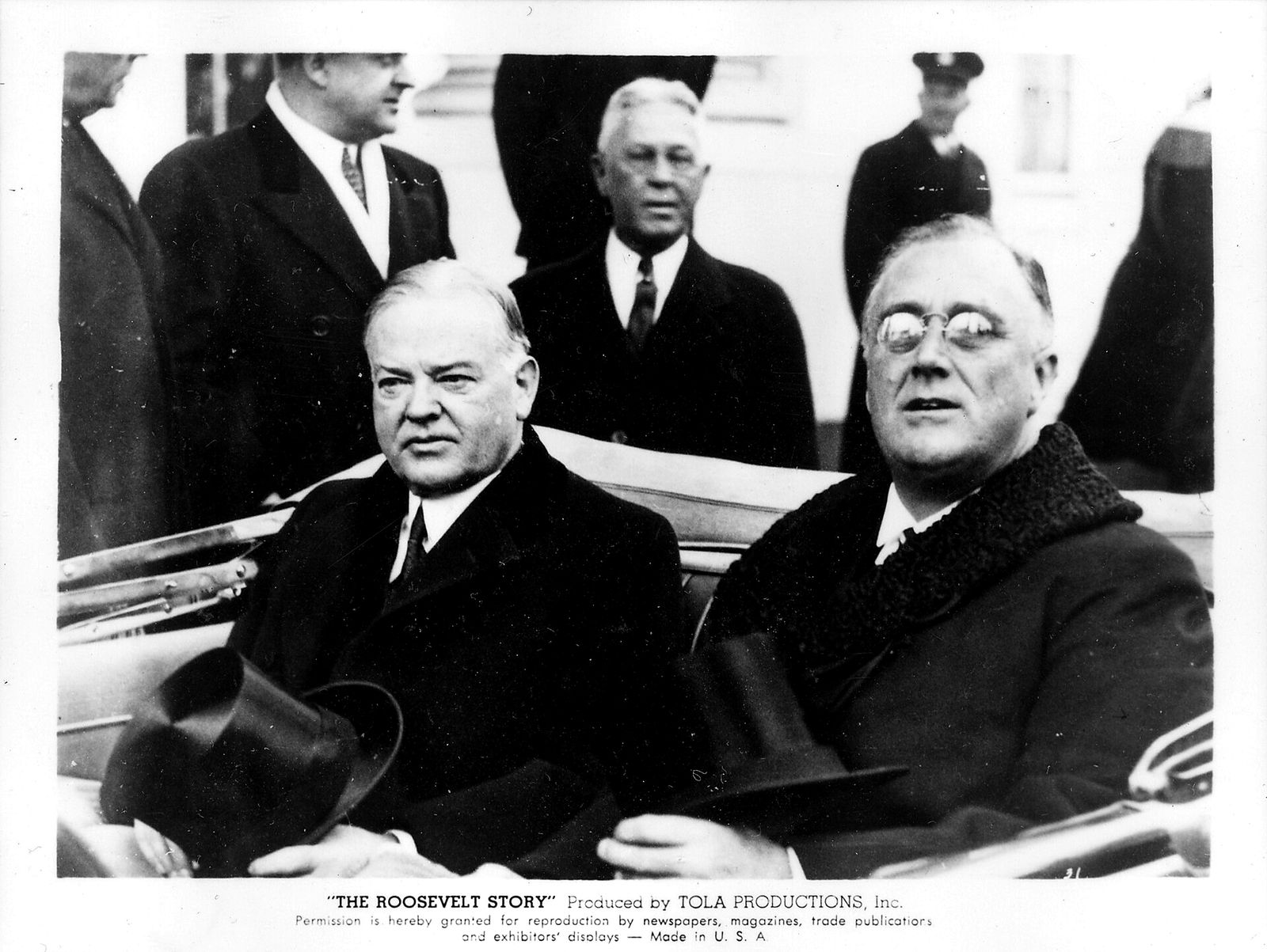 Herbert Hoover and Franklin Roosevelt riding together in an open car, 1933