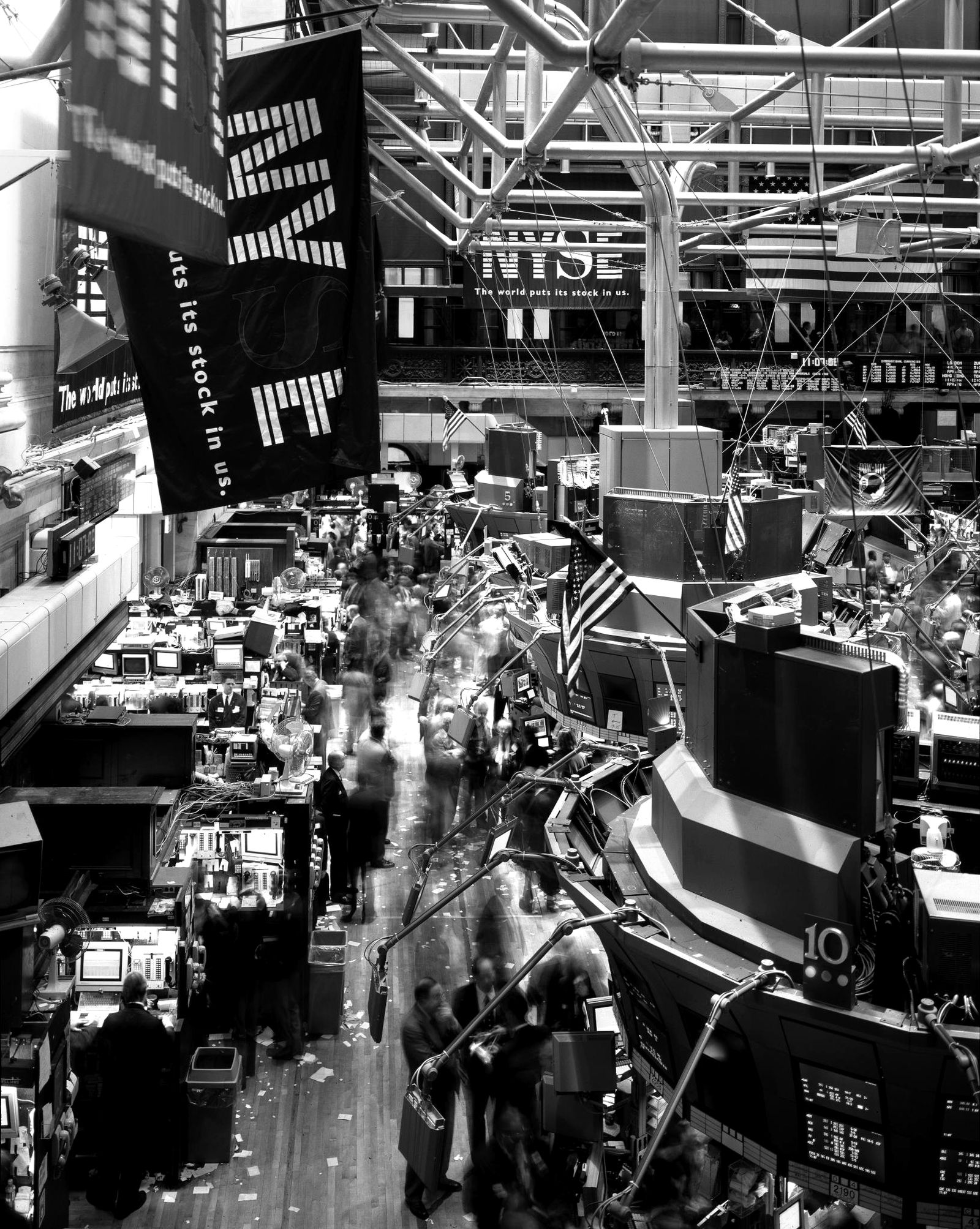 Traders and screens on the floor of the New York Stock Exchange