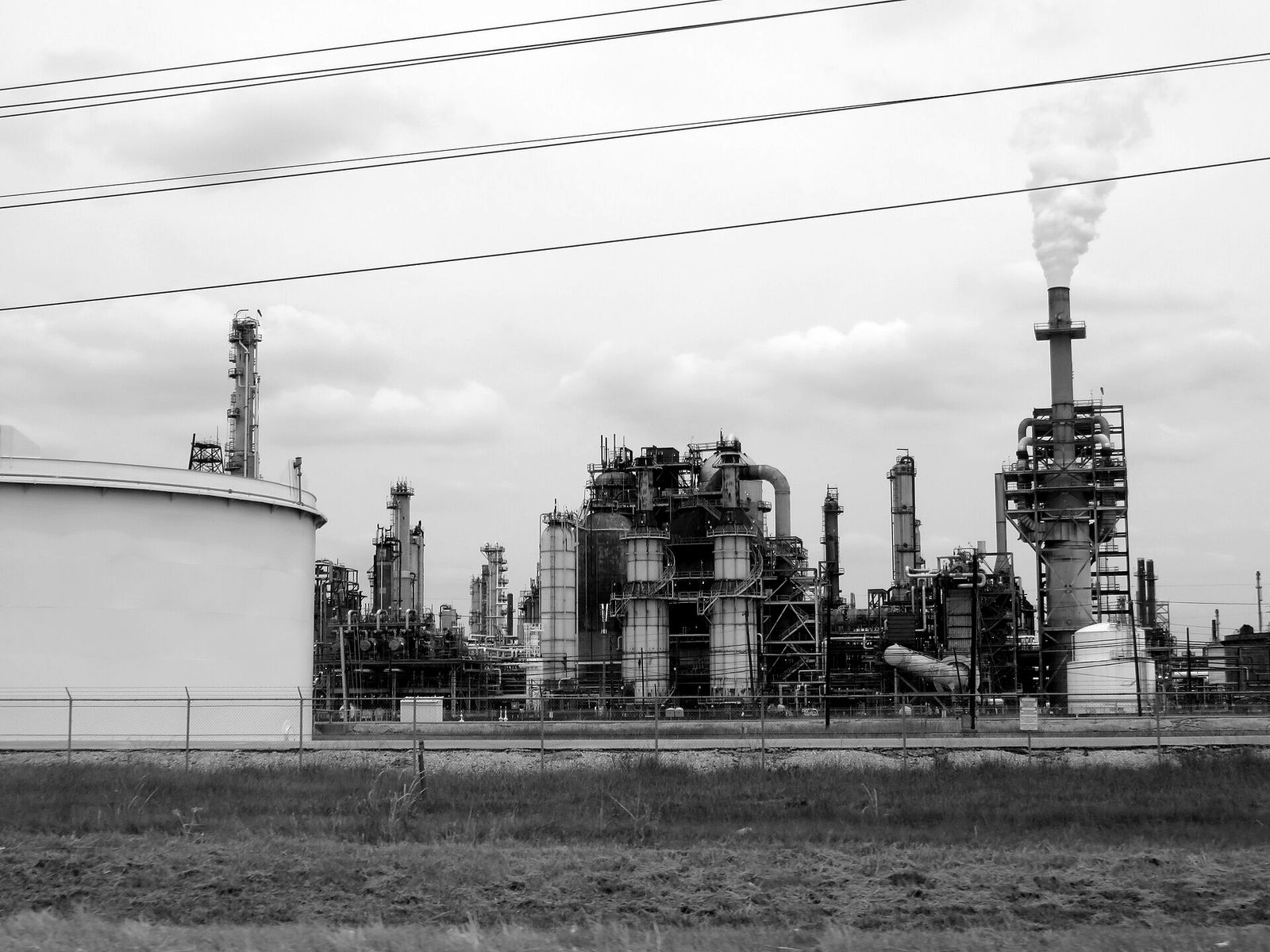 An oil refinery in Houston, with towers, pipes and a smokestack